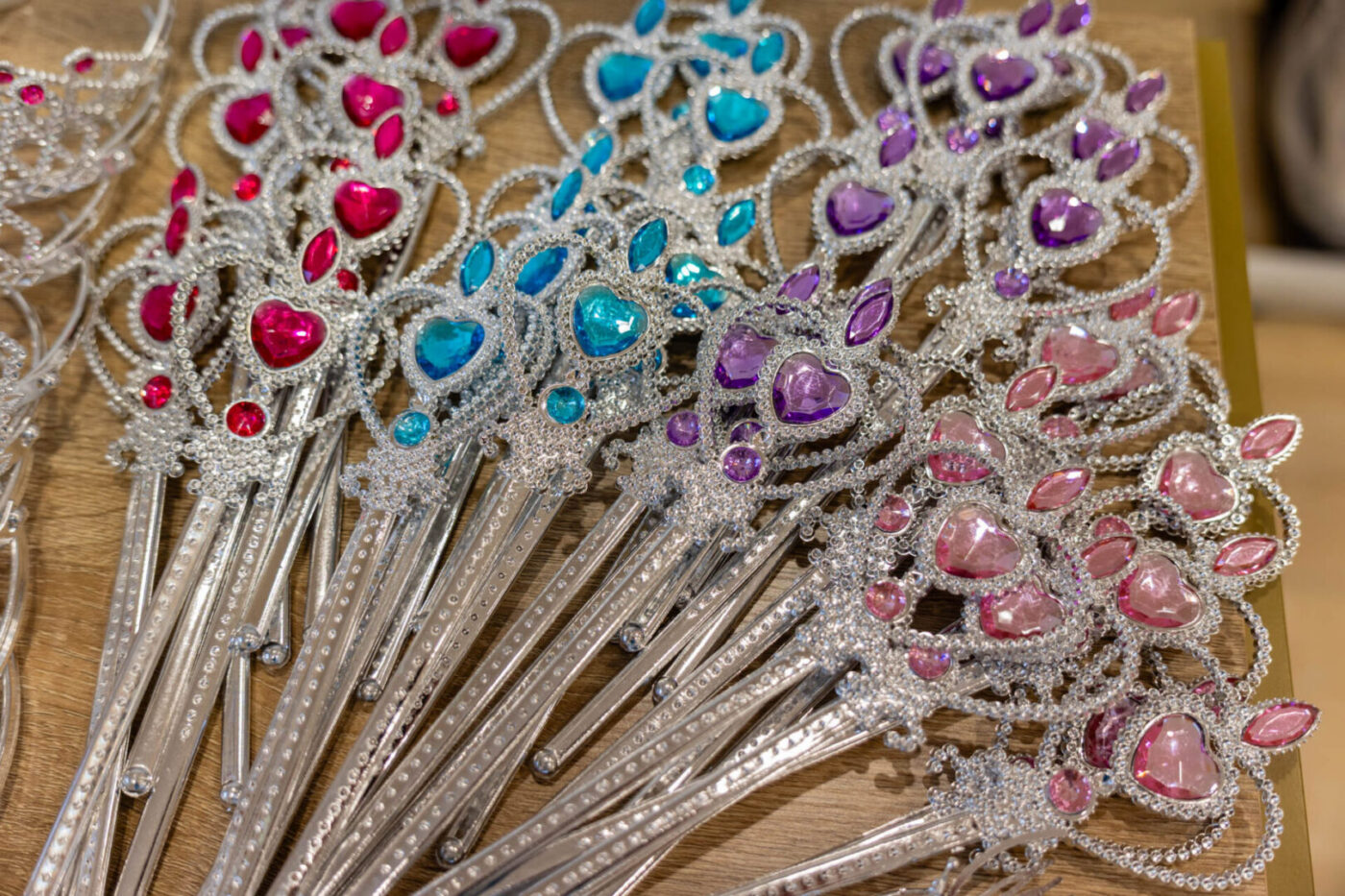 Colorful toy wands with sparkling gem decorations.